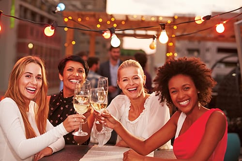 Girlfriends at rooftop party