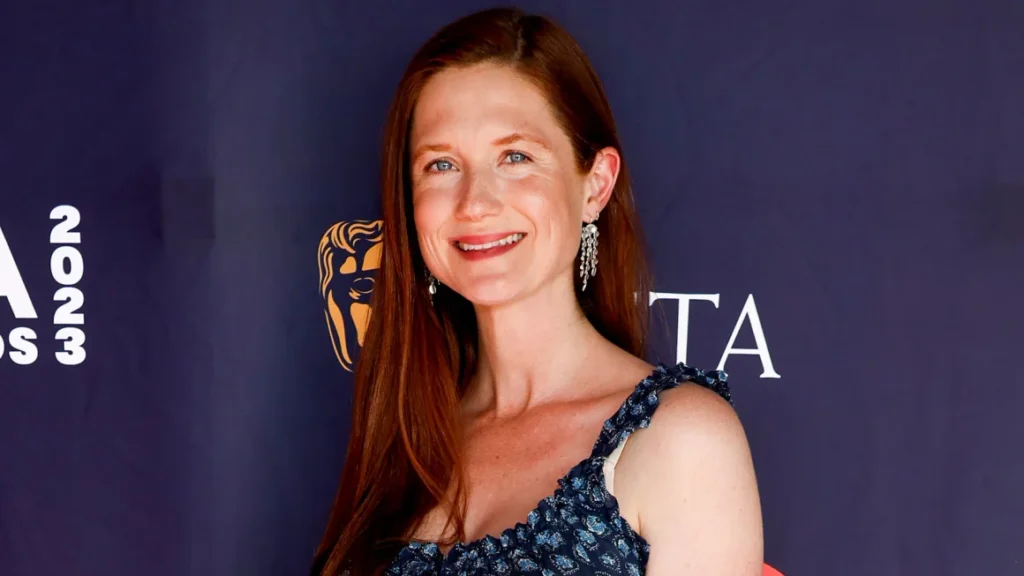 Seductive redhead celebrity in fashion portrait