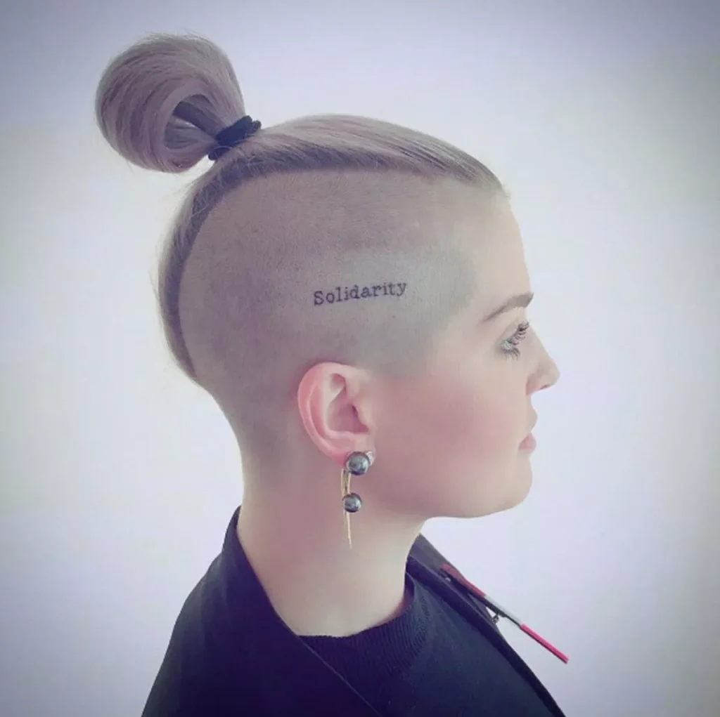 Kelly Osbourne’s “Solidarity” Shaved Head Tattoo