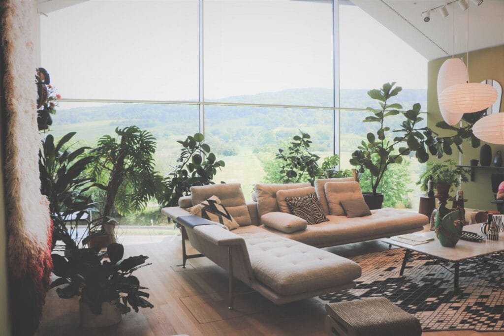 Cozy seating nook with armchairs and a side table in a luxury bedroom.