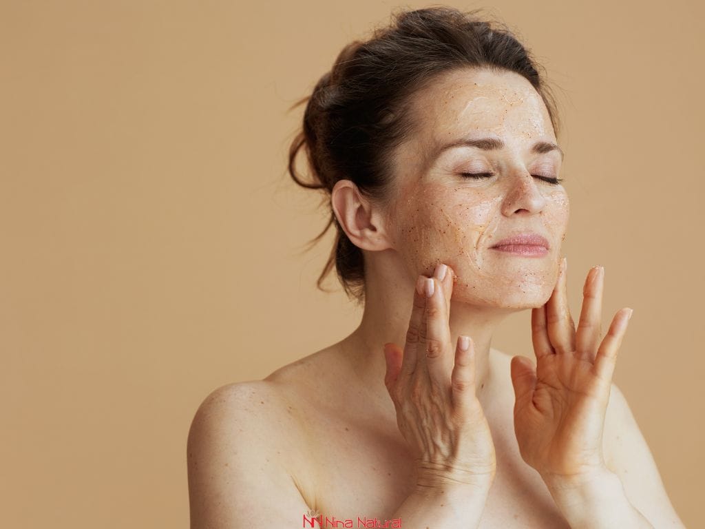 Using a gentle facial scrub or AHA exfoliant during nighttime skincare