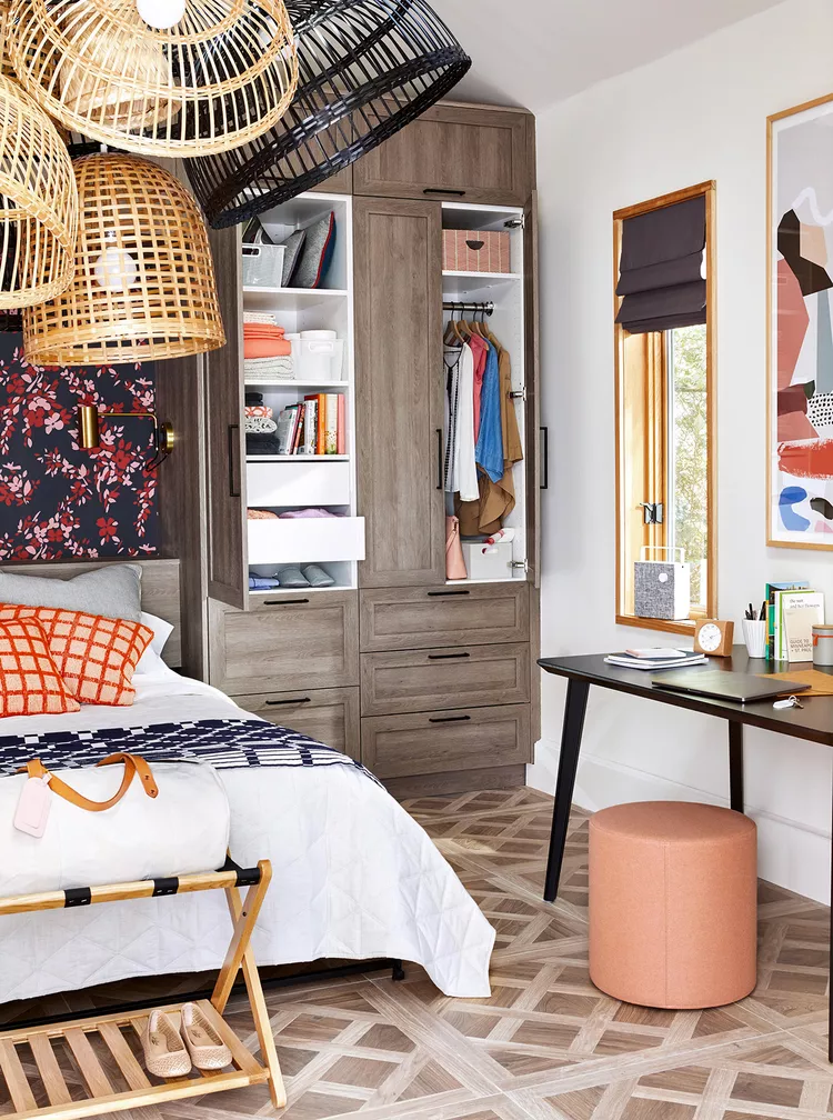 Walk-in closet with glass doors and elegant built-in shelving.