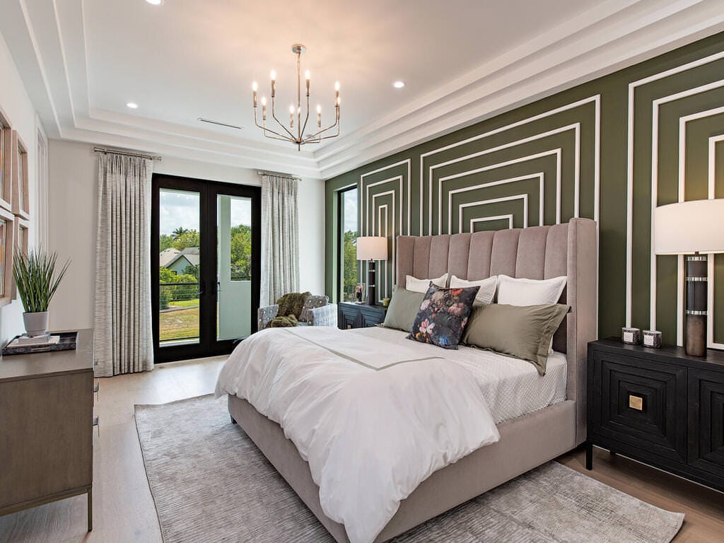 Accent wall with textured wallpaper and wall panels in a luxury bedroom.