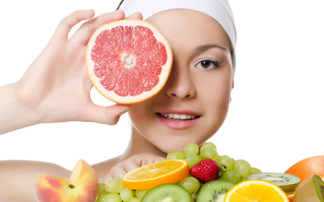 Healthy lifestyle with woman drinking water, eating fruits, and doing yoga