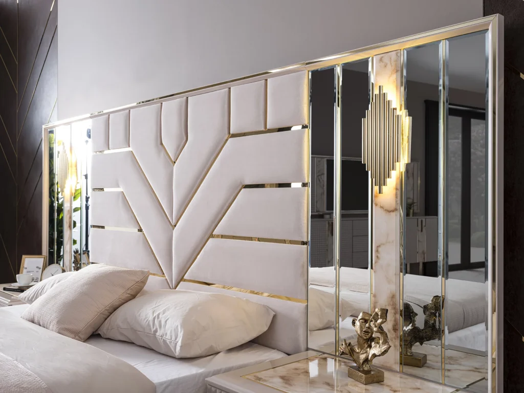 Oversized tufted velvet headboard as a focal point in a luxury bedroom.
