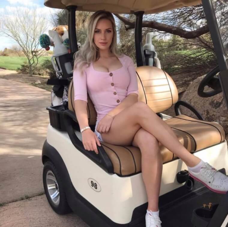 Paige Spiranac posing on the University of Arizona golf course as a college athlete.