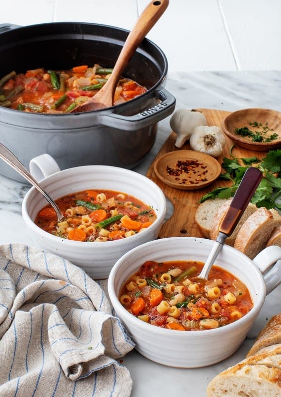 Flat lay of assorted quick healthy meals like tuna wraps, baked fish, and quinoa stuffed peppers.”