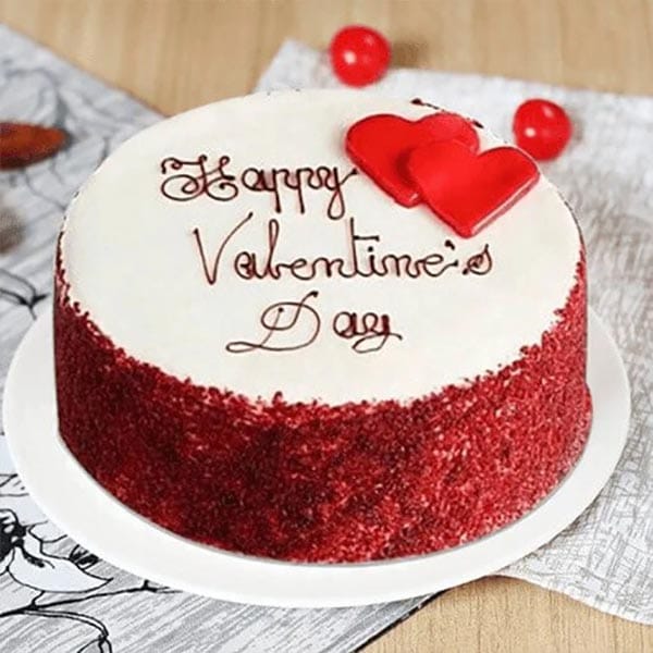 “Slice of classic red velvet cake with cream cheese frosting for Valentine’s Day dessert”