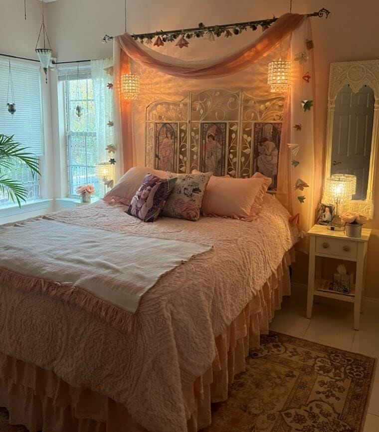 A DIY headboard made by hanging fabric or a rug from a tension rod behind a bed for an affordable and creative look.
