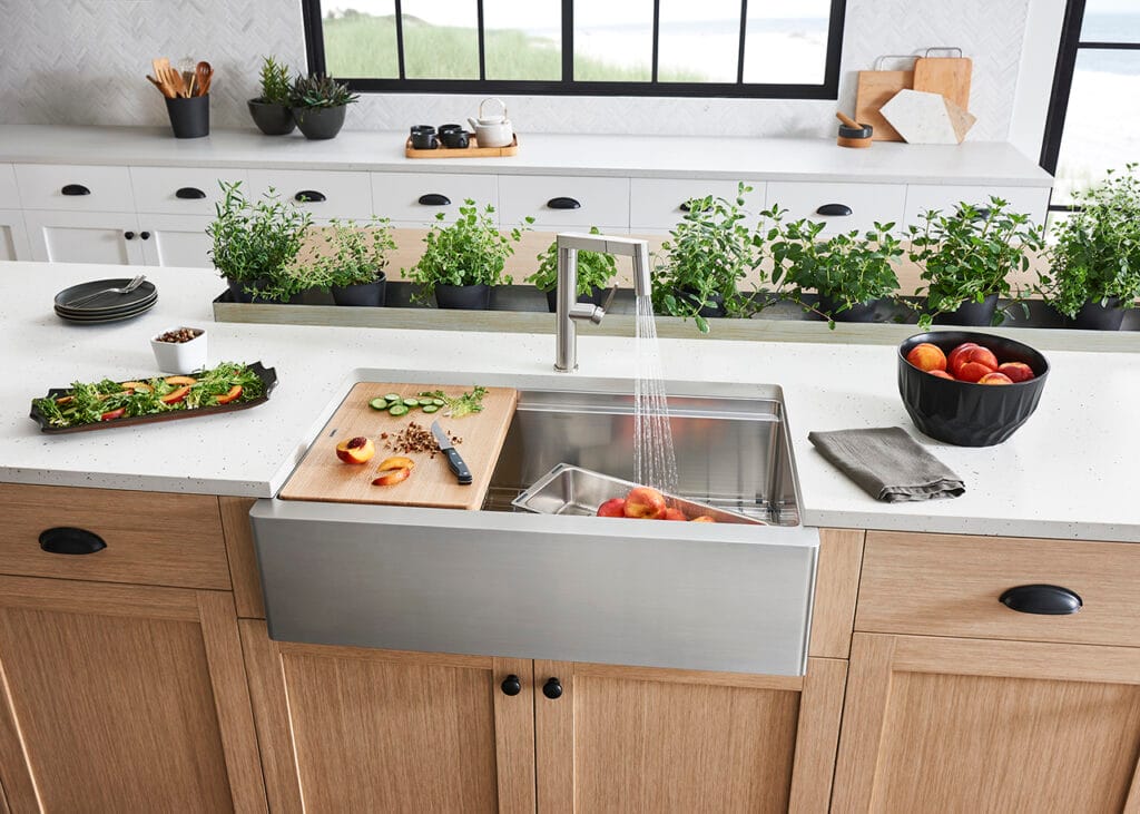 “Rustic wooden butcher block countertop in a farmhouse kitchen with vintage cutting boards and metal utensils.”