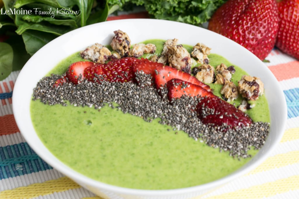 “Green smoothie bowl made with spinach, avocado, and kiwi topped with pumpkin seeds and blueberries.”