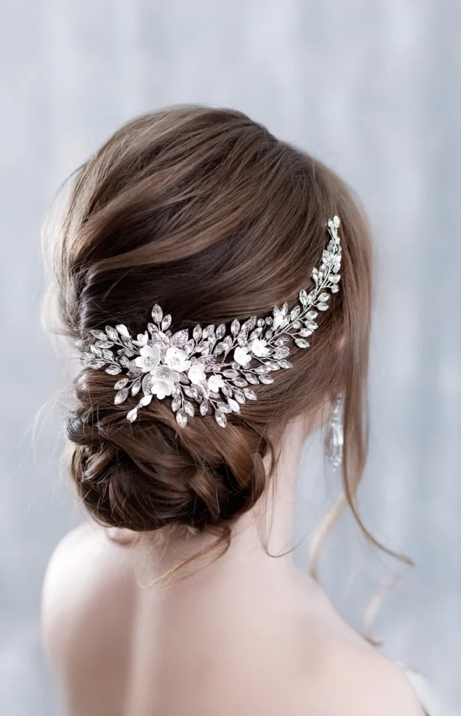 Ariana Grande wearing crystal headband at a red carpet event.”