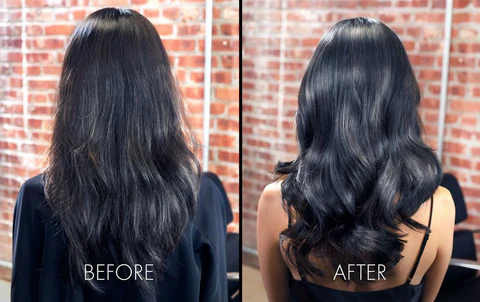 "Hair styled with soft waves, subtle highlights, and a healthy glossy finish."