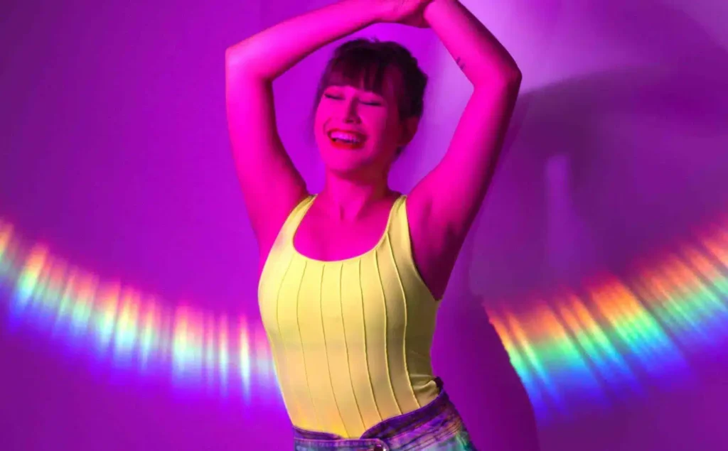 Content creator recording a new TikTok dance with lighting and camera setup.