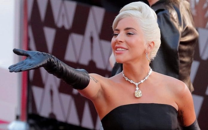 “Lady Gaga wearing Tiffany 128-carat yellow diamond necklace at the Oscars.”