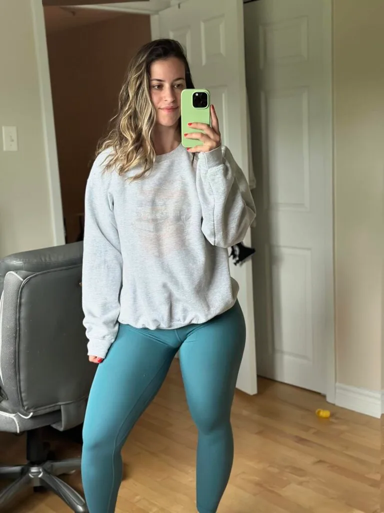 “Woman wearing high-waisted seamless leggings in gym.”