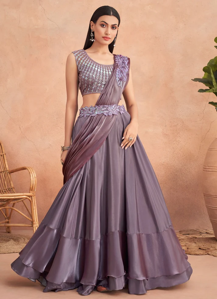 Embellished lehenga-style sari with flared skirt and ornate pallu, perfect for weddings or receptions.
