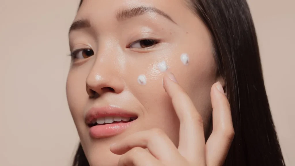 “Nighttime skincare products like serum and sleeping mask on vanity.”