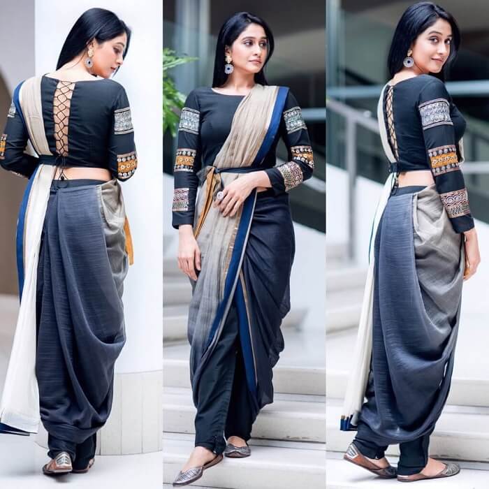 Model showcasing a sari draped over cigarette pants, paired with a structured blazer for a chic formal look.