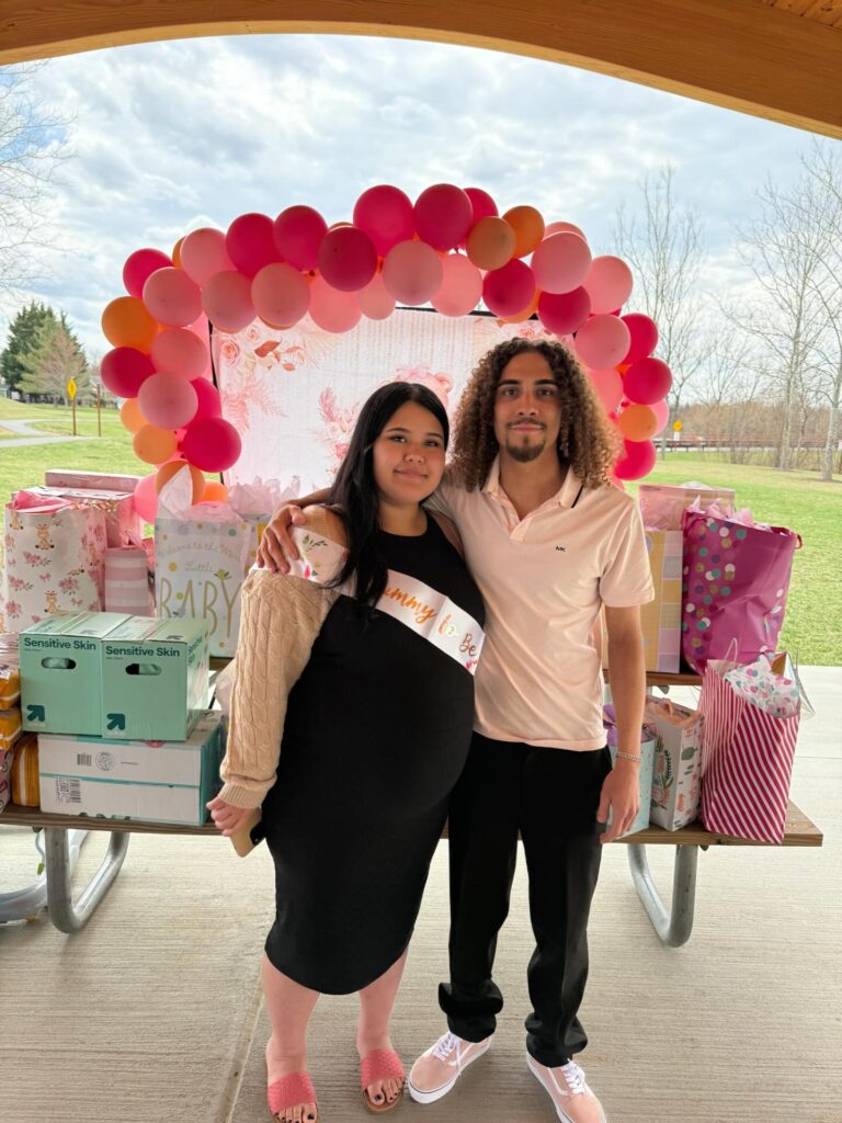 Curvy woman in peplum top and skinny jeans highlighting big belly and thick thighs fashion.