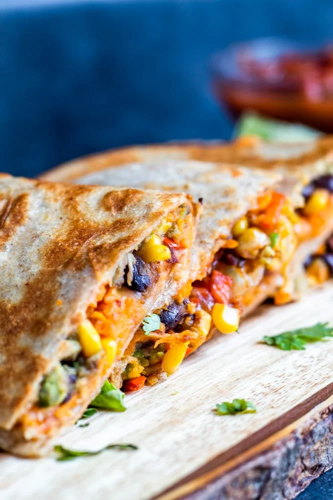 “Golden brown veggie quesadilla filled with spinach, mushrooms, and melted cheese.”