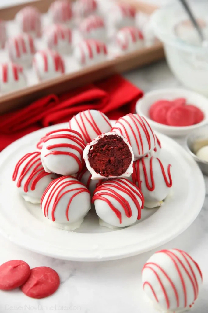 “Homemade red velvet truffles dipped in white chocolate and decorated with Valentine sprinkles”