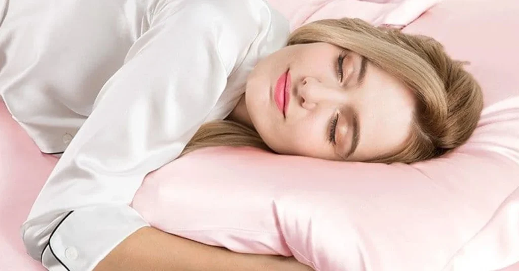 “Silk pillowcase on bed symbolizing smooth skin and frizz-free hair.”