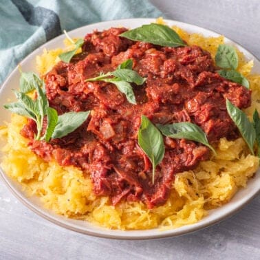 Spaghetti squash topped with marinara sauce and Parmesan cheese.”