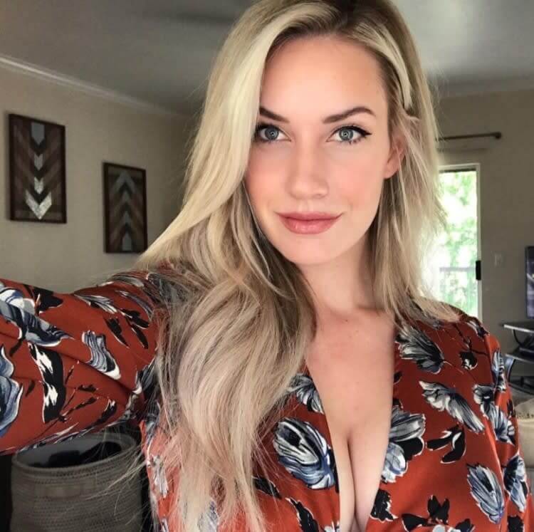 Paige Spiranac speaking at an event about cyberbullying awareness and prevention.