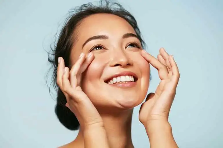 “Facial yoga exercise to reduce smile lines and lift cheeks.”