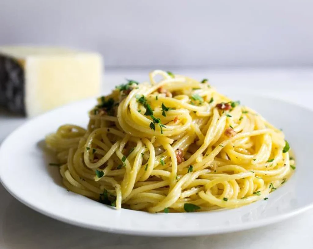 “Creamy spaghetti alla carbonara made with eggs, cheese, and pancetta – a classic Italian pasta dish to cook at home.”