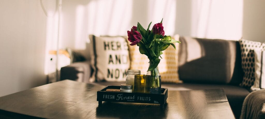 “Couple’s bedroom featuring framed photos, personalized pillows, and sentimental wall art.”