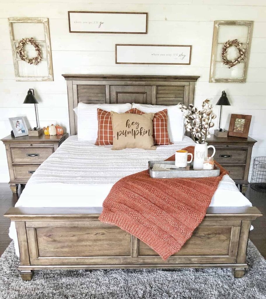 “Bedroom with cozy fall decor and seasonal accents for a warm atmosphere.”
