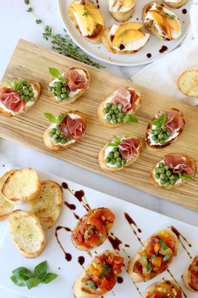 “Assorted bruschetta toppings including tomato basil, goat cheese, and smoked salmon.”