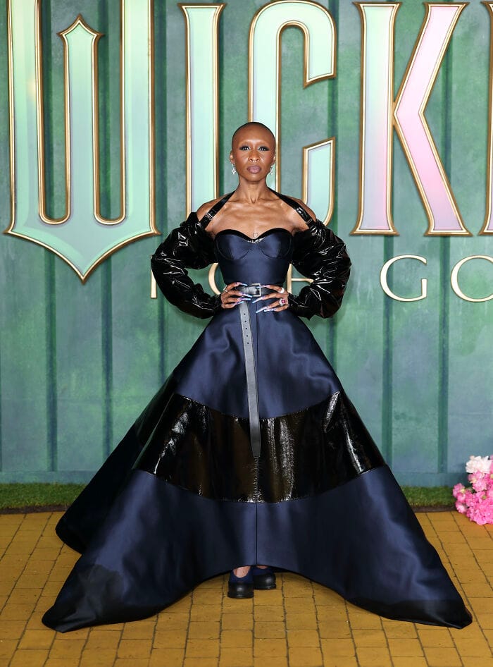 Cynthia Erivo wearing a blue and black Prada off-shoulder gown at the Wicked: For Good premiere in London.