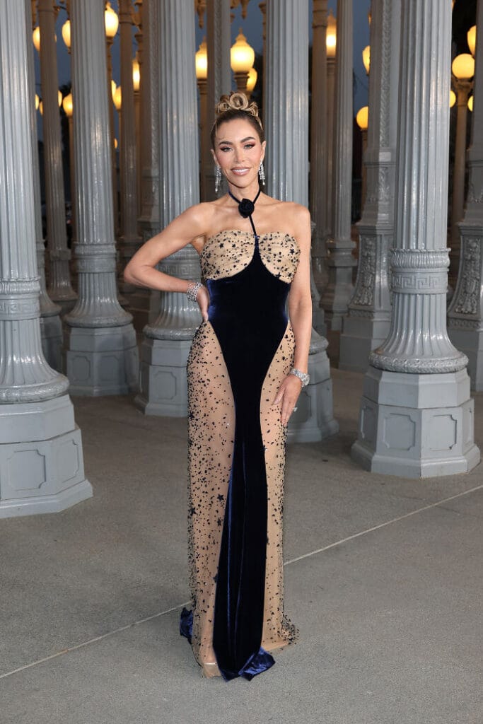 Tara Dollinger poses in a Schiaparelli navy and nude velvet gown featuring star cutouts at the 2025 LACMA Gala.