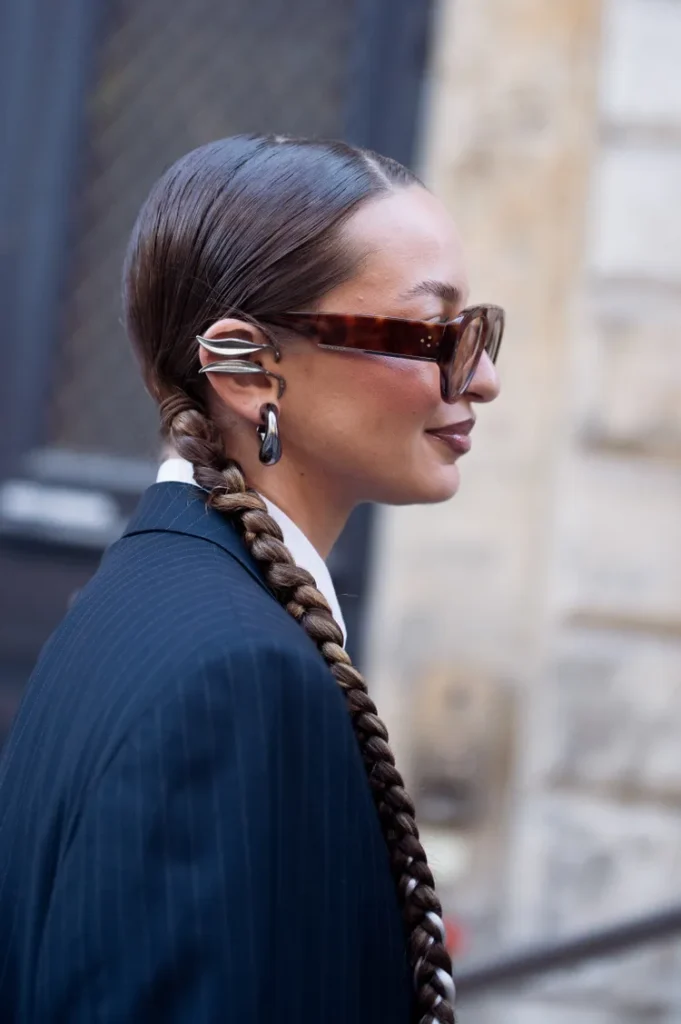 “Close-up of chunky ear cuffs styled as statement jewelry for winter accessorizing.”