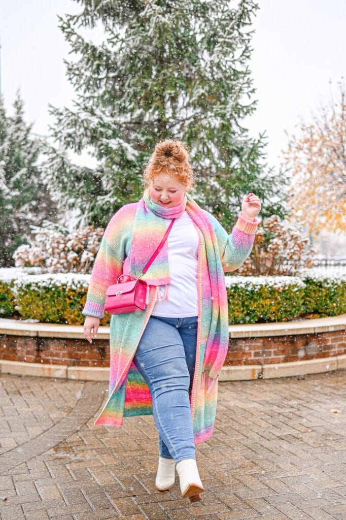Warm plus size winter outfit with sweater, jeans, and boots