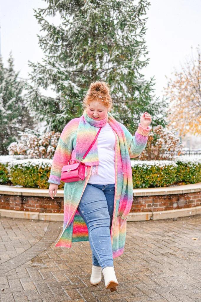Warm plus size winter outfit with sweater, jeans, and boots