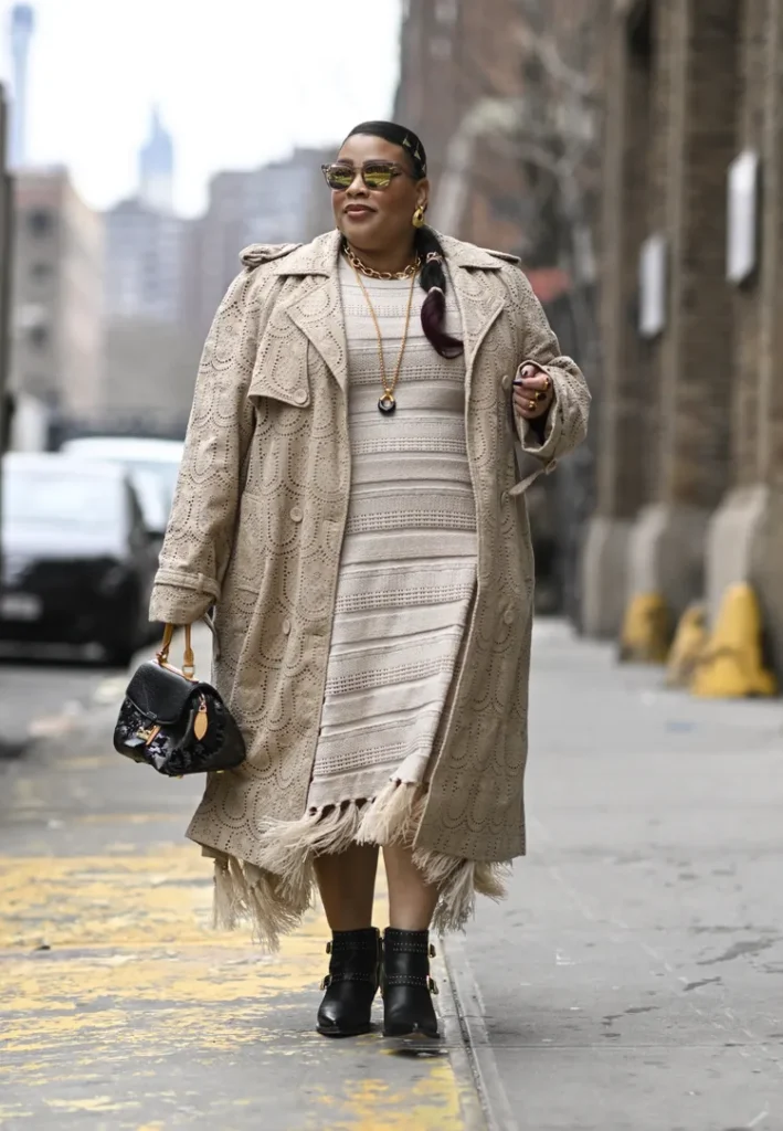 “Knitted fringe jacket adding movement and flair to a winter outfit.”