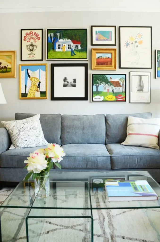 “Creative gallery wall with assorted frames and mixed art pieces in the living room”