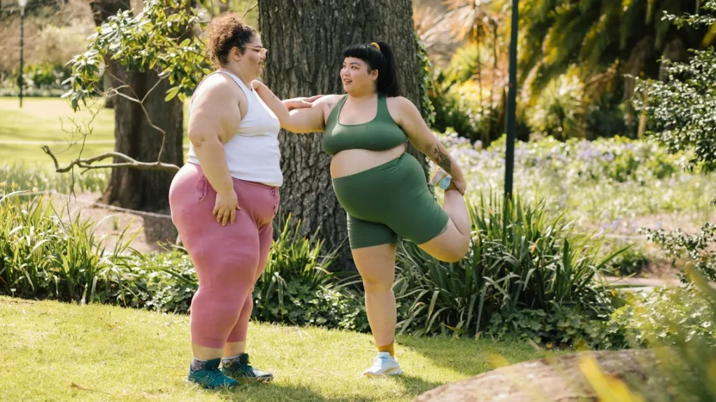 Polished plus size activewear outfit with clean sneakers and accessories