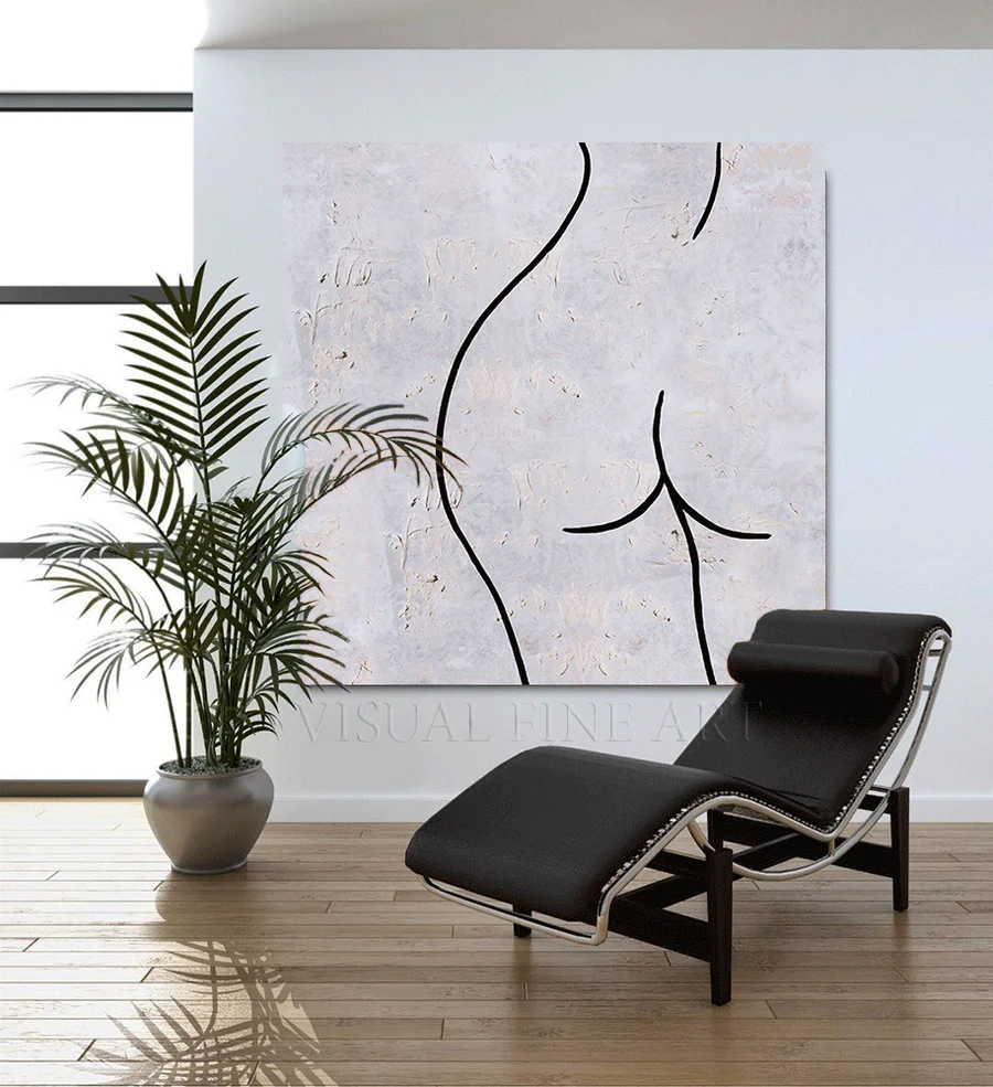 “Minimal line art wall print hanging above a neutral sofa”