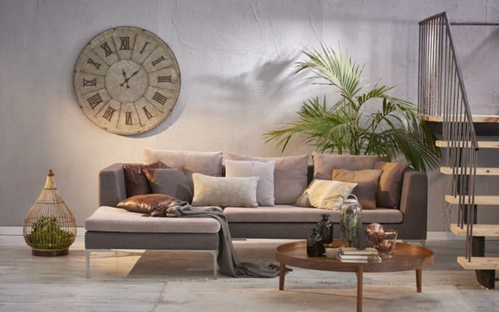 “Extra large decorative wall clock above living room console table”