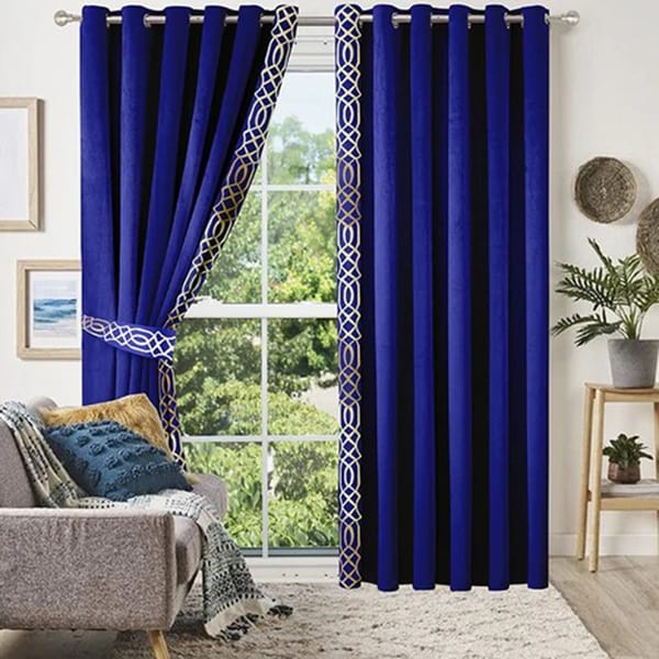 Rich velvet curtains in a modern living room adding texture and luxurious depth.