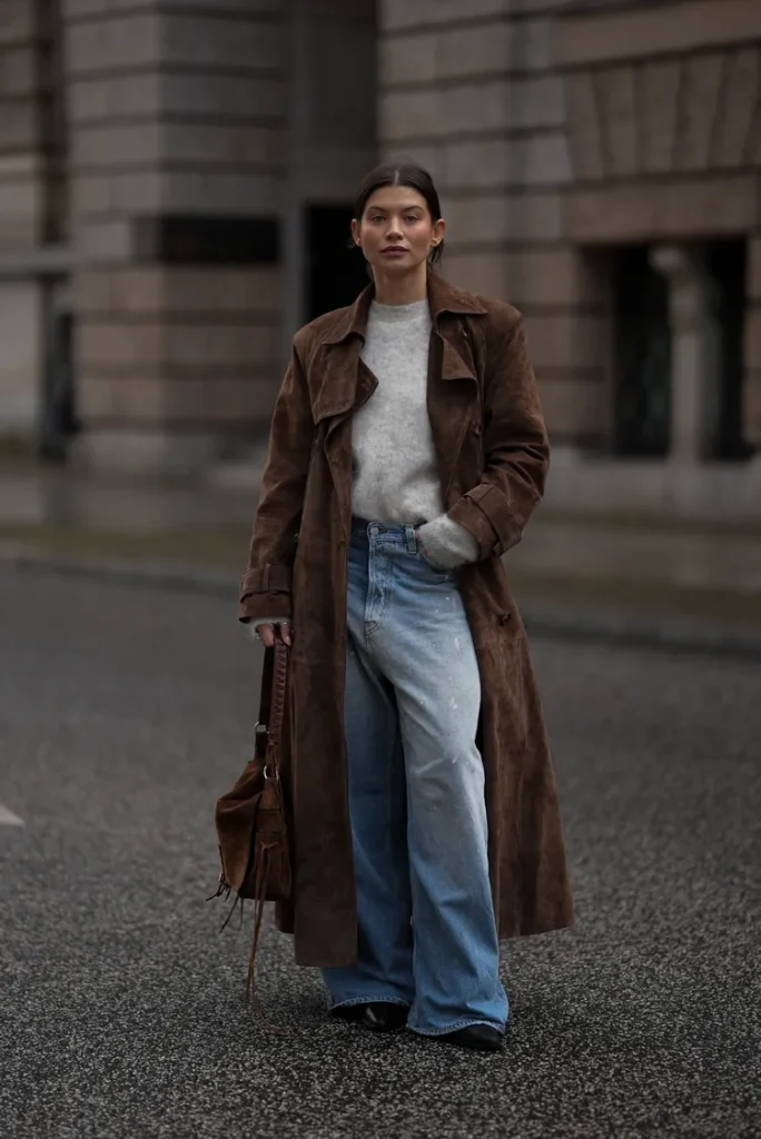 “Suede jacket styled with denim and neutral winter tones for a textured December look.”